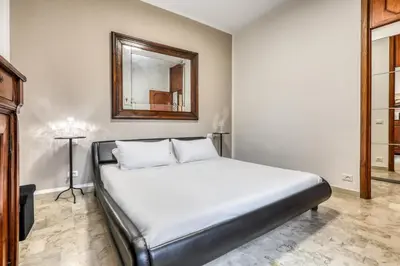 Letto o letti in una camera di ANGOLO DI CORSO CAVOUR - Ultimo piano centrale e luminoso