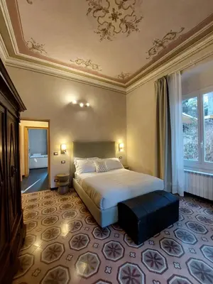 Letto o letti in una camera di Villa Ghiron