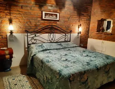 Letto o letti in una camera di Il Corvo Viaggiatore