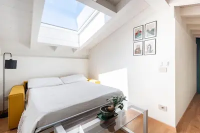 Letto o letti in una camera di Domus: modern Loft in the center of Parma