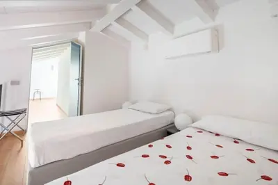 Letto o letti in una camera di Domus: modern Loft in the center of Parma