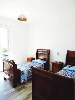 Letto o letti in una camera di Villa Luigia