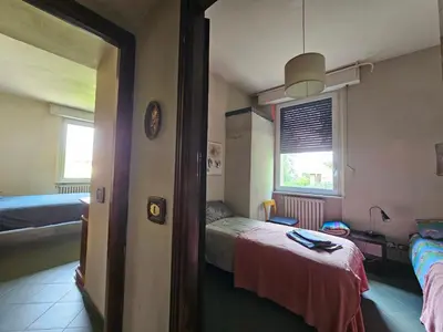 Letto o letti in una camera di Casa VINCENZO 130 mq con portico ed ingresso esclusivo dal giardino