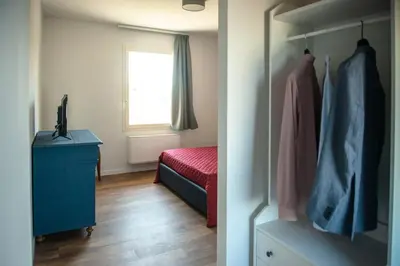 Letto o letti in una camera di FORESTERIA LOMBARDA BED and BIKE CREMONA