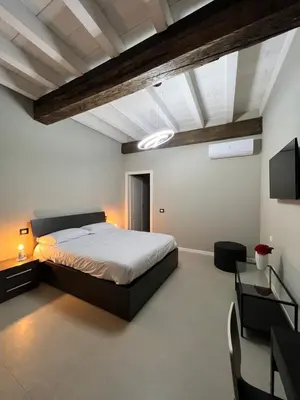 Letto o letti in una camera di V&B Suites and Apartments