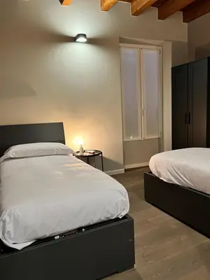 Letto o letti in una camera di V&B Suites and Apartments