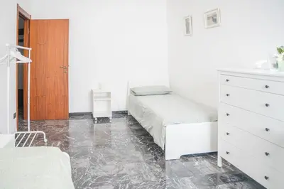 Letto o letti in una camera di 083 - Casa Grande con Attico condominiale vista mare, 500 metri dalla spiaggia