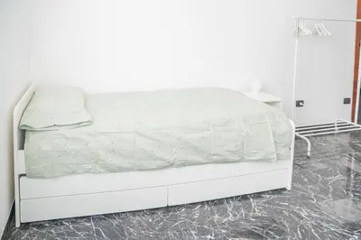Letto o letti in una camera di 083 - Casa Grande con Attico condominiale vista mare, 500 metri dalla spiaggia
