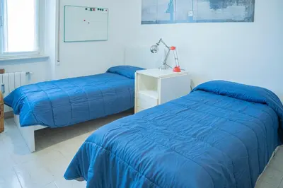 Letto o letti in una camera di 076 - Casa La Libreria, Centro città di Chiavari, 500 metri da mare e spiagge - 2 CAMERE DA LETTO
