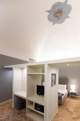 Letto o letti in una camera di Palazzo Liberati Apartments - Manu Maison