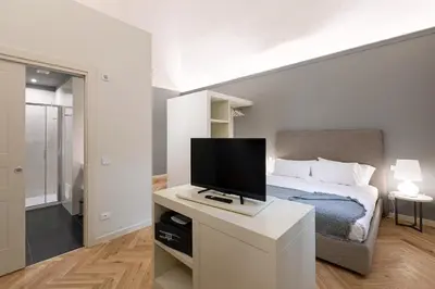 Letto o letti in una camera di Palazzo Liberati Apartments - Manu Maison