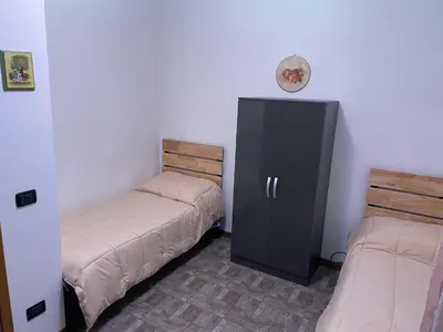 Letto o letti in una camera di Intero appartamento Parma Fiere