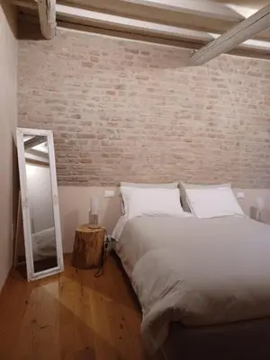 Letto o letti in una camera di Casa Alberti