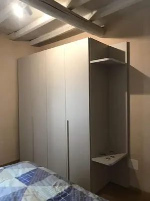 Letto o letti in una camera di Casa Alberti