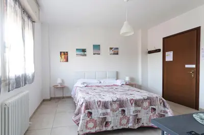 Letto o letti in una camera di FARE BnB - Room Pappagnocca