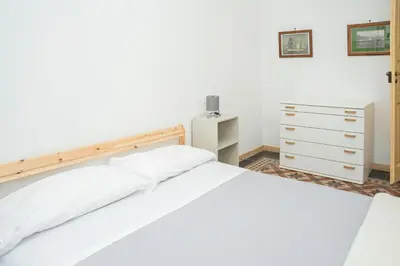 Letto o letti in una camera di 057 - Casa Portobello, Centrale a 50 metri dal mare
