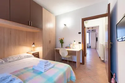 Letto o letti in una camera di GuestHost - Parma Historic Center Apartment 7min from Duomo