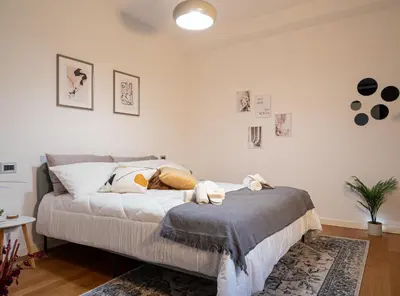 Letto o letti in una camera di Maison Blanche: appartamento elegante con parcheggio privato