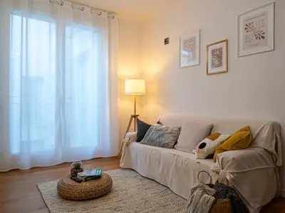 Letto o letti in una camera di Maison Blanche: appartamento elegante con parcheggio privato