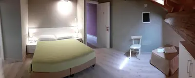 Letto o letti in una camera di Affittacamere ADELPHIA