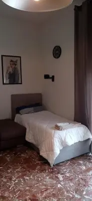 Letto o letti in una camera di Casa SARA FIDENZA