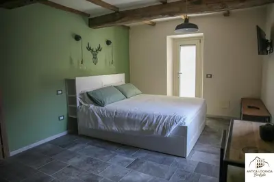 Letto o letti in una camera di Antica Locanda Bonfiglio