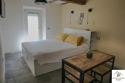 Letto o letti in una camera di Antica Locanda Bonfiglio