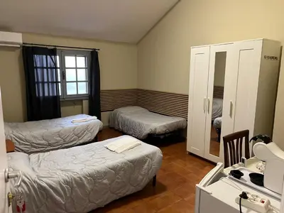 Letto o letti in una camera di Ristorante Turismo Steak house B&B