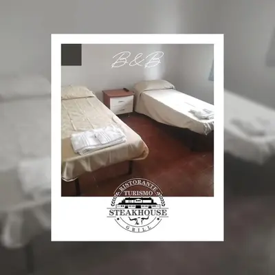 Letto o letti in una camera di Ristorante Turismo Steak house B&B