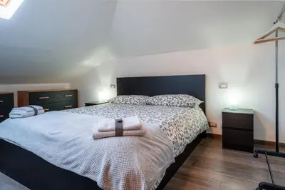 Letto o letti in una camera di LA SOFFITTA DEI SOGNI 010059-LT-2481