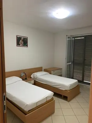 Letto o letti in una camera di Mood-San Matteo Residence Parva Urbi
