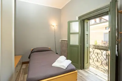 Letto o letti in una camera di Appartamento Roma 55