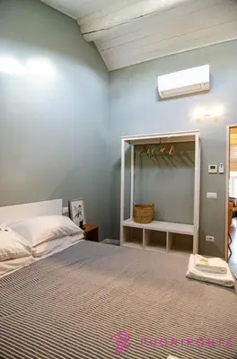 Letto o letti in una camera di Corte 1 con parcheggio gratuito