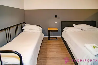 Letto o letti in una camera di FuoriPorta Affitti Brevi - Corte 2 con parcheggio gratuito