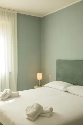 Letto o letti in una camera di Lei Rooms