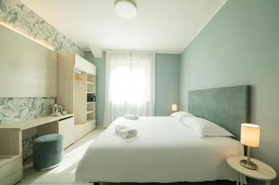 Letto o letti in una camera di Lei Rooms