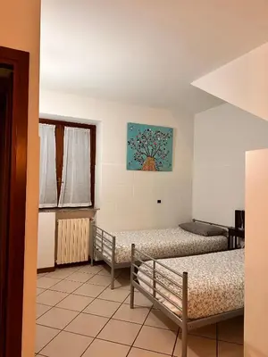 Letto o letti in una camera di casa nonna Rica