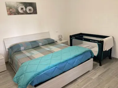 Letto o letti in una camera di La casa nel verde con piscina