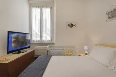 Letto o letti in una camera di Casa Marilù nel centro storico di Rapallo by Wonderful Italy