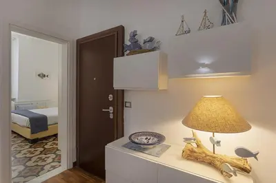 Letto o letti in una camera di Casa Marilù nel centro storico di Rapallo by Wonderful Italy