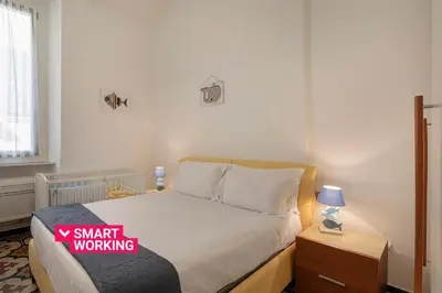 Letto o letti in una camera di Casa Marilù nel centro storico di Rapallo by Wonderful Italy