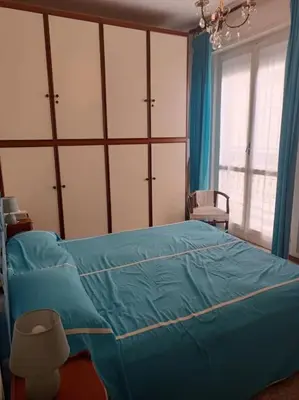 Letto o letti in una camera di Incantevole appartamento davanti al mare, Chiavari