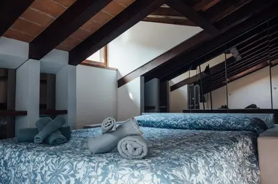 Letto o letti in una camera di Palazzo Te - Casa mantovana Giuseppina Rippa