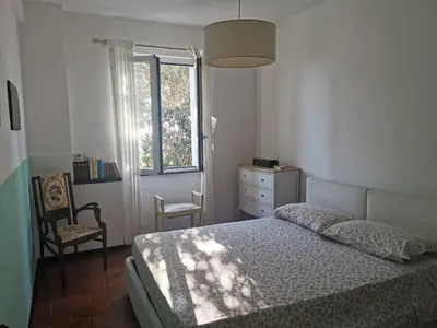 Letto o letti in una camera di WHITE & BLUE HOUSE