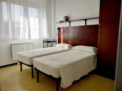 Letto o letti in una camera di Casa Cristina, vista mare a pochi passi dalle spiagge