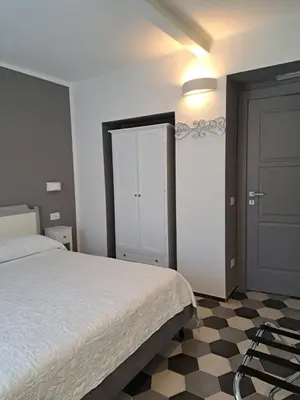 Letto o letti in una camera di PAVIAN