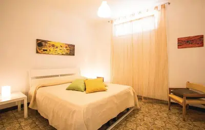Letto o letti in una camera di La Quiete