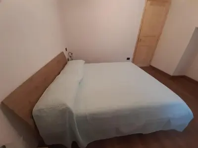 Letto o letti in una camera di Casa Ylenia