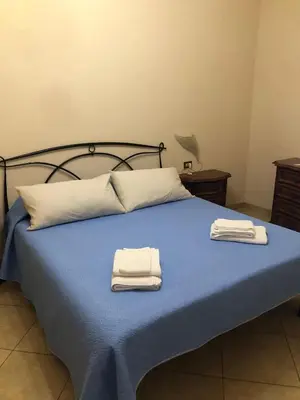 Letto o letti in una camera di Appartamento Via Rezzano vista mare