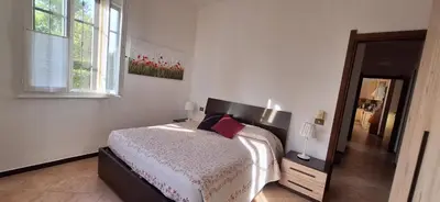 Letto o letti in una camera di Casa Anna - piano T e giardino